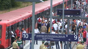 FANS ON TRAIN PLATFORM - 1 - Film & Video Stock