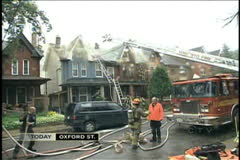 FIREFIGHTERS RESPOND TO HOUSE FIRE - Film & Video Stock